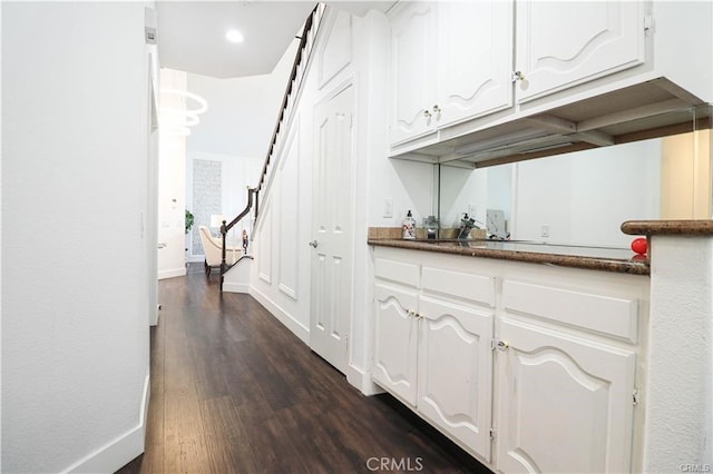 2430 Spring Meadow Dr, Chino Hills, CA 91709 - bar area featuring dark wood-style flooring and baseboards