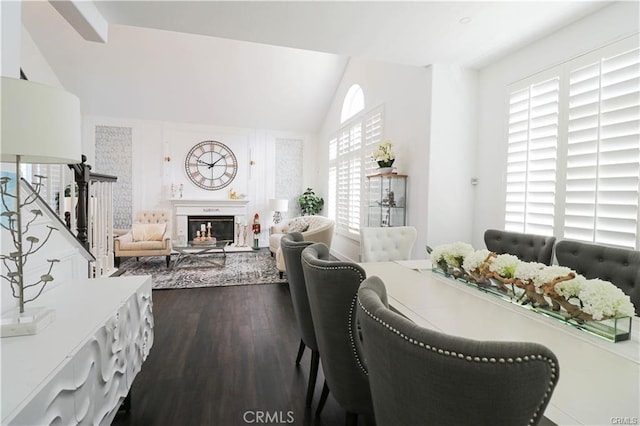 2430 Spring Meadow Dr, Chino Hills, CA 91709 - dining area with lofted ceiling, dark wood-style floors, and a glass covered fireplace