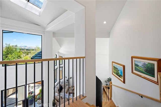 433 Emerald Bay Dr, Arroyo Grande, CA 93420 - corridor with an upstairs landing, vaulted ceiling, a skylight, recessed lighting, and wood finished floors