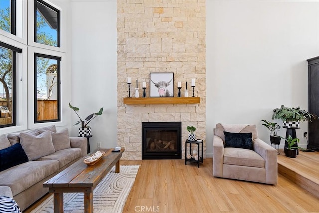 433 Emerald Bay Dr, Arroyo Grande, CA 93420 - living area with wood finished floors, a fireplace, and a high ceiling