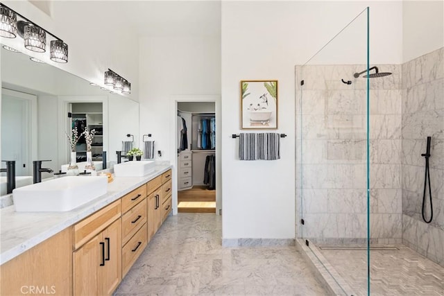 433 Emerald Bay Dr, Arroyo Grande, CA 93420 - full bathroom featuring vanity, a walk in closet, walk in shower, and marble look tiles