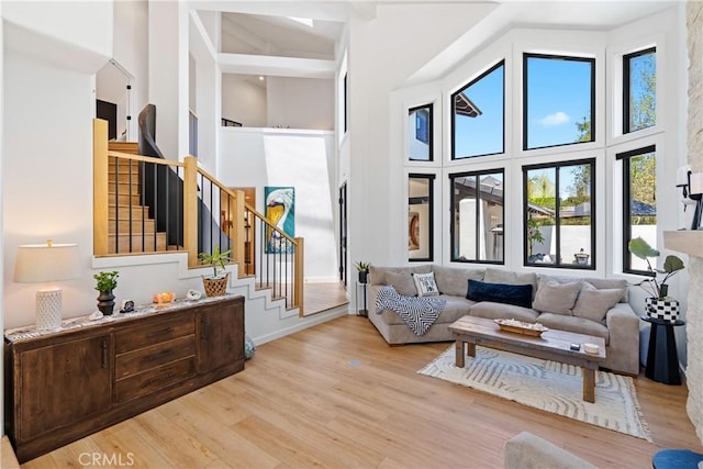 433 Emerald Bay Dr, Arroyo Grande, CA 93420 - living room featuring a towering ceiling, wood finished floors, and stairs