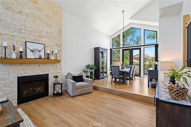 433 Emerald Bay Dr, Arroyo Grande, CA 93420 - living area with light wood-style flooring, high vaulted ceiling, and a fireplace