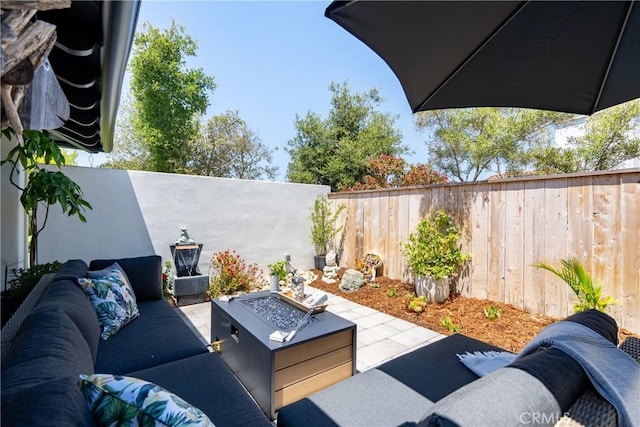 433 Emerald Bay Dr, Arroyo Grande, CA 93420 - fenced backyard with an outdoor living space with a fire pit and a patio area