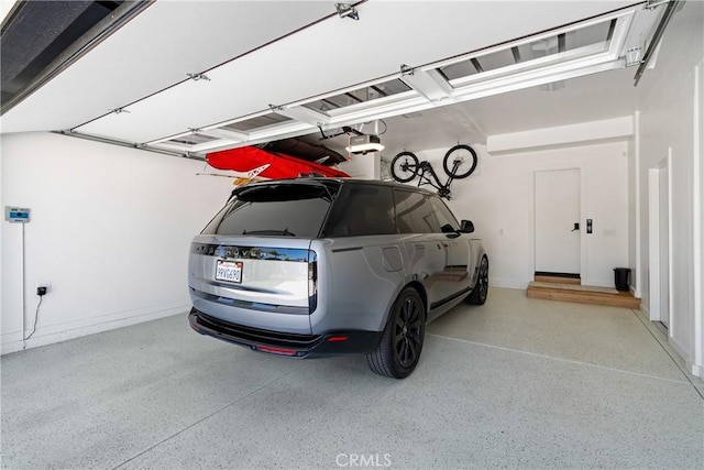 433 Emerald Bay Dr, Arroyo Grande, CA 93420 - garage with a garage door opener and baseboards