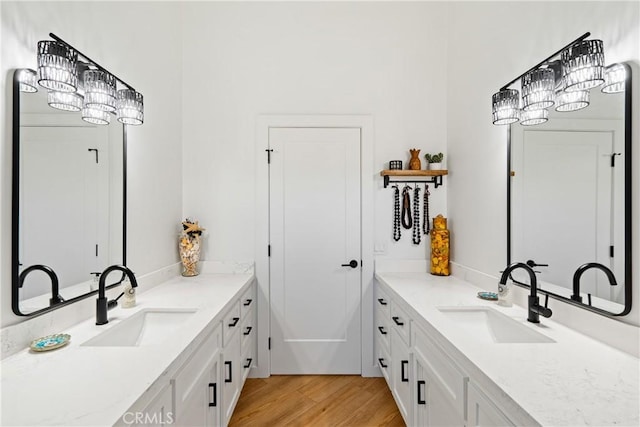 433 Emerald Bay Dr, Arroyo Grande, CA 93420 - bathroom featuring two vanities and wood finished floors