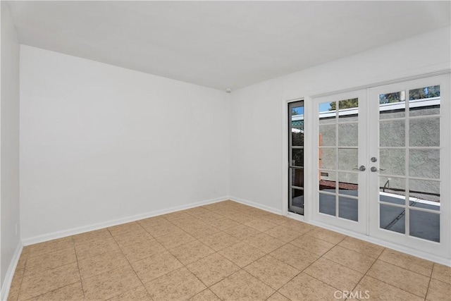 18 Denver Unit 71, Irvine, CA 92604 - unfurnished room with baseboards and french doors
