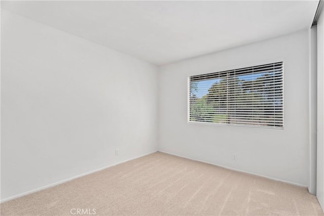 18 Denver Unit 71, Irvine, CA 92604 - unfurnished room featuring light carpet