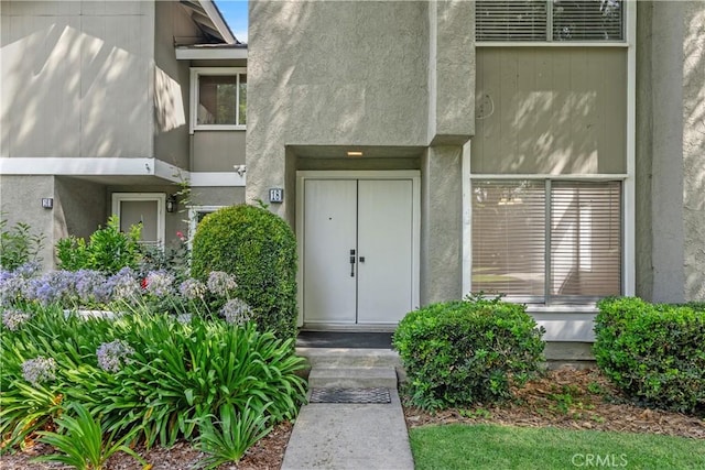 18 Denver Unit 71, Irvine, CA 92604 - doorway to property with stucco siding