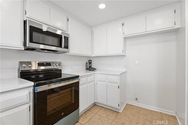 18 Denver Unit 71, Irvine, CA 92604 - kitchen with stainless steel appliances, white cabinets, and recessed lighting