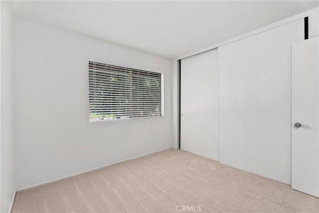 18 Denver Unit 71, Irvine, CA 92604 - unfurnished bedroom with carpet floors and a closet