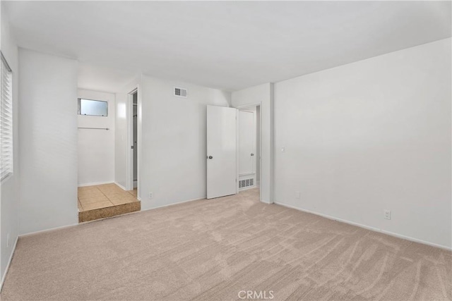 18 Denver Unit 71, Irvine, CA 92604 - spare room with light carpet and baseboards