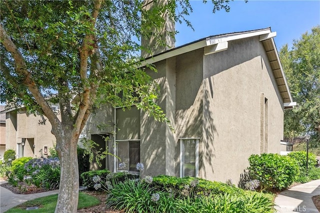 18 Denver Unit 71, Irvine, CA 92604 - view of property exterior featuring stucco siding