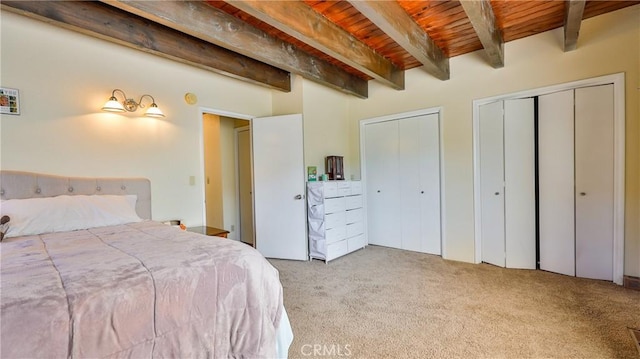 448 Delle Dr, Crestline, CA 92325 - bedroom with carpet floors, multiple closets, and a wooden ceiling with exposed beams