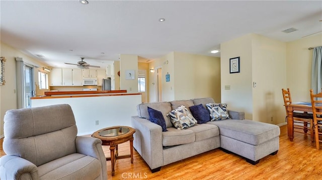 448 Delle Dr, Crestline, CA 92325 - living area with light wood-style floors and ceiling fan