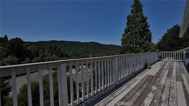 448 Delle Dr, Crestline, CA 92325 - wooden terrace featuring a forest view and a mountain view