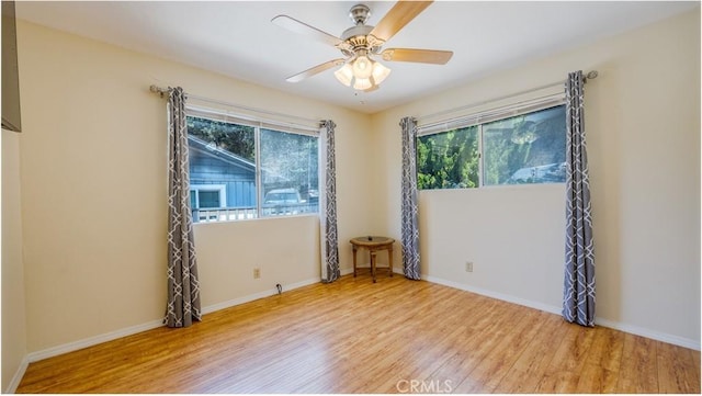 448 Delle Dr, Crestline, CA 92325 - empty room featuring plenty of natural light, wood finished floors, and ceiling fan