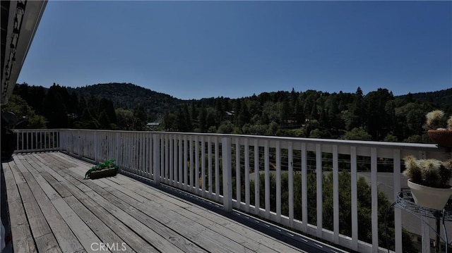 448 Delle Dr, Crestline, CA 92325 - wooden deck with a wooded view and a mountain view