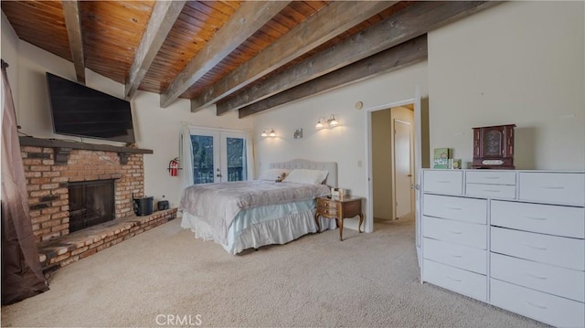 448 Delle Dr, Crestline, CA 92325 - bedroom with a wooden ceiling with exposed beams, french doors, light colored carpet, and a brick fireplace