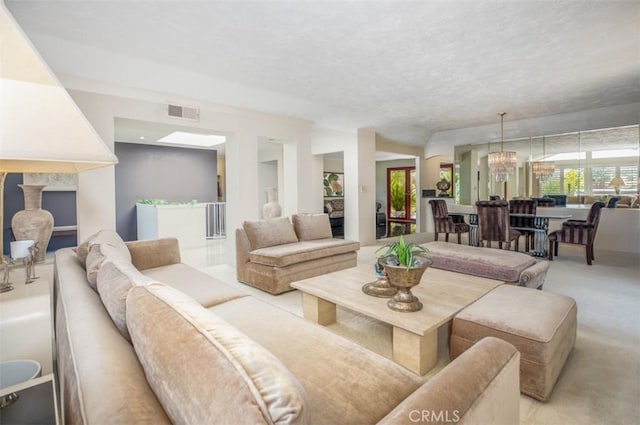 31781 National Park Dr, Laguna Niguel, CA 92677 - living area with light carpet, a chandelier, and a textured ceiling