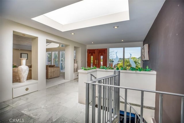 31781 National Park Dr, Laguna Niguel, CA 92677 - hall with a skylight, marble tiled floors, recessed lighting, and an upstairs landing