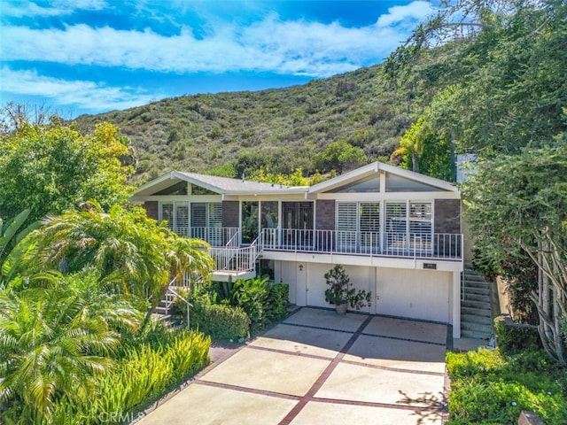 31781 National Park Dr, Laguna Niguel, CA 92677 - view of front of property featuring stairs, a mountain view, and driveway
