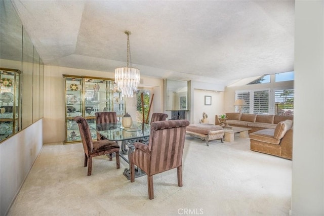 31781 National Park Dr, Laguna Niguel, CA 92677 - carpeted dining space featuring healthy amount of natural light, a chandelier, a textured ceiling, and vaulted ceiling