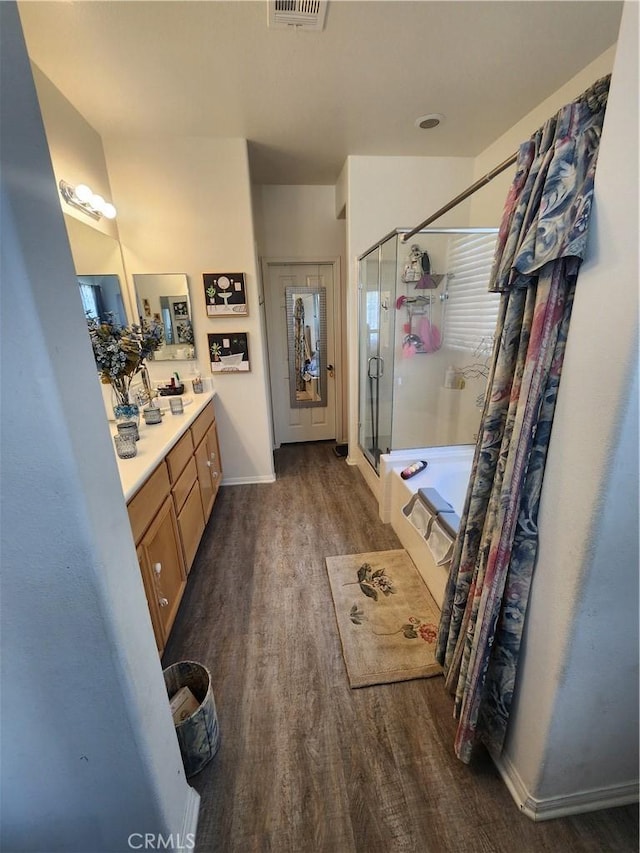 37882 Lopez Ln, Palmdale, CA 93552 - bathroom with wood finished floors, a stall shower, and vanity