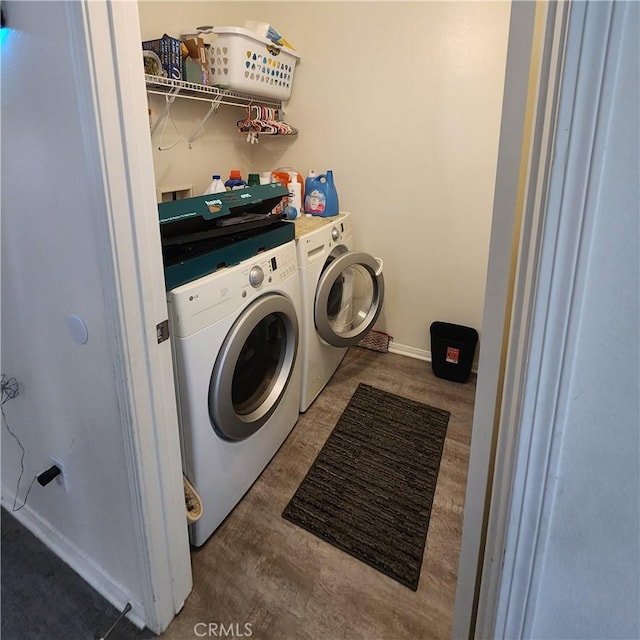 37882 Lopez Ln, Palmdale, CA 93552 - laundry room featuring washing machine and dryer and wood finished floors