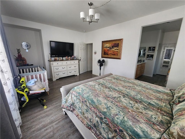 37882 Lopez Ln, Palmdale, CA 93552 - bedroom with a chandelier and wood finished floors