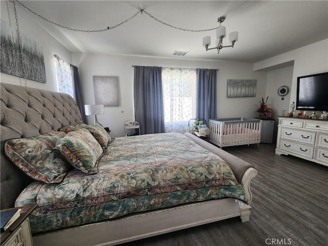 37882 Lopez Ln, Palmdale, CA 93552 - bedroom with wood finished floors and a chandelier