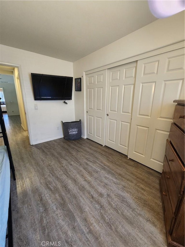 37882 Lopez Ln, Palmdale, CA 93552 - unfurnished bedroom with wood finished floors and a closet