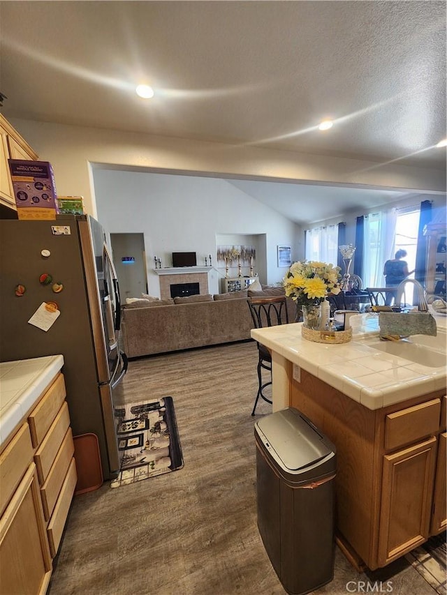 37882 Lopez Ln, Palmdale, CA 93552 - kitchen featuring tile counters, freestanding refrigerator, open floor plan, dark wood finished floors, and recessed lighting