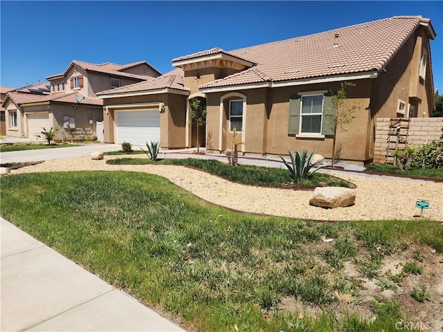 37882 Lopez Ln, Palmdale, CA 93552 - view of front of house with stucco siding, a garage, a tiled roof, and driveway