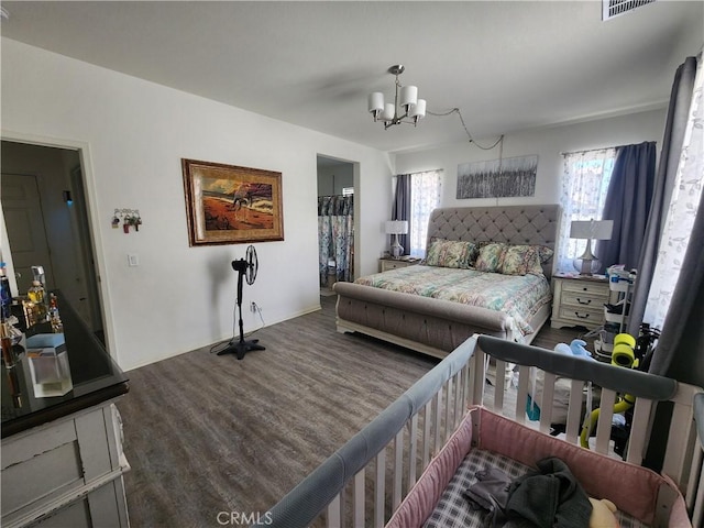 37882 Lopez Ln, Palmdale, CA 93552 - bedroom featuring wood finished floors and a chandelier