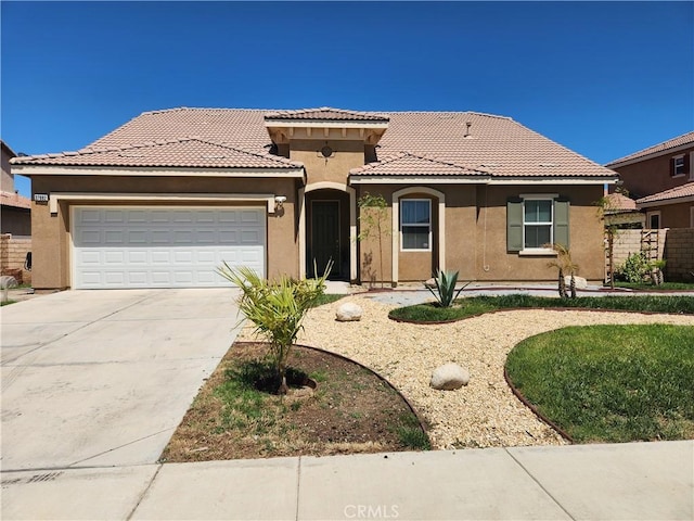 37882 Lopez Ln, Palmdale, CA 93552 - mediterranean / spanish home with stucco siding, driveway, a garage, and a tiled roof