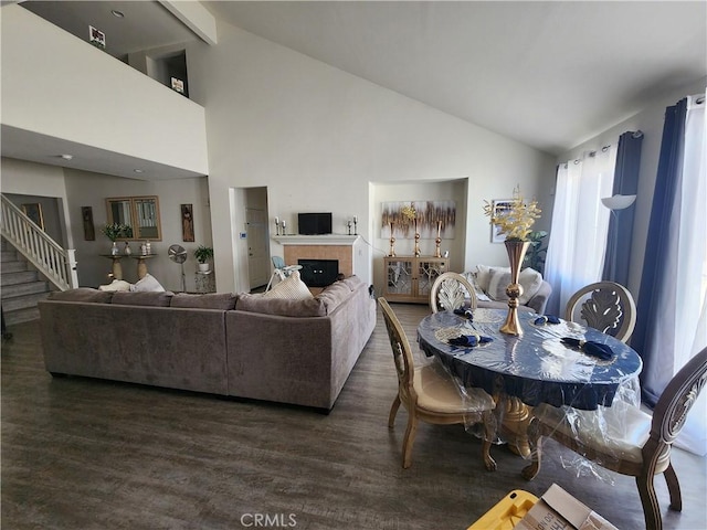 37882 Lopez Ln, Palmdale, CA 93552 - living room with dark wood-type flooring, high vaulted ceiling, stairs, a fireplace, and beamed ceiling