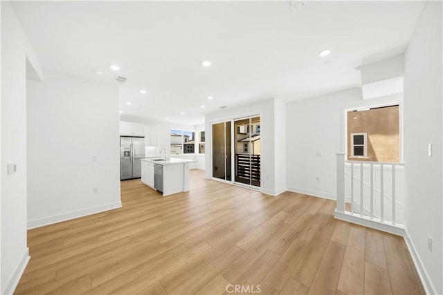 470 Lobata, Irvine, CA 92618 - unfurnished living room featuring light wood-style flooring and recessed lighting
