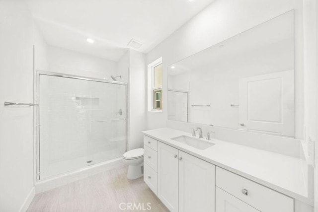 470 Lobata, Irvine, CA 92618 - bathroom featuring a shower stall, vanity, wood finished floors, and recessed lighting