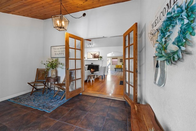 1415 Rex Ln, El Cajon, CA 92021 - entryway featuring french doors, wooden ceiling, arched walkways, and a chandelier