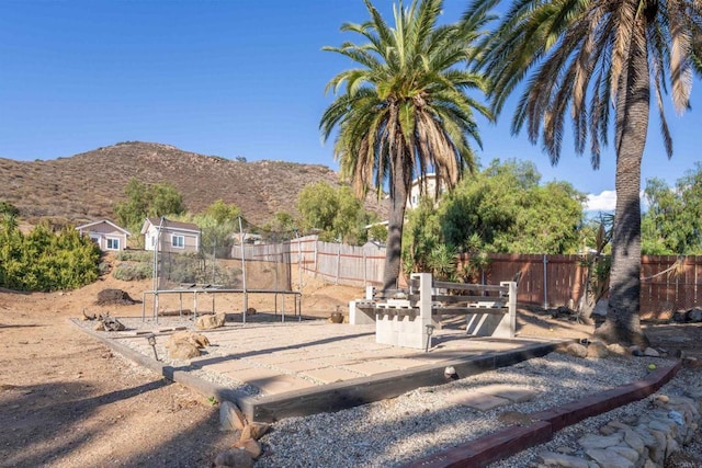 1415 Rex Ln, El Cajon, CA 92021 - view of yard featuring a mountain view and a trampoline