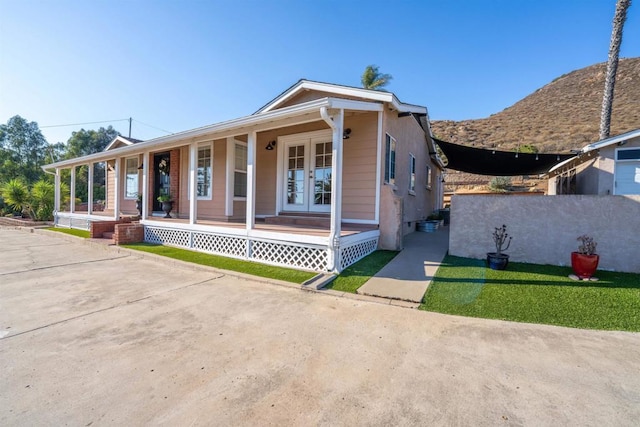 1415 Rex Ln, El Cajon, CA 92021 - view of front of home featuring french doors and covered porch