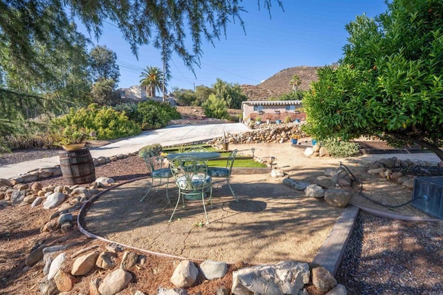 1415 Rex Ln, El Cajon, CA 92021 - view of yard featuring a patio, a mountain view, and outdoor dining space