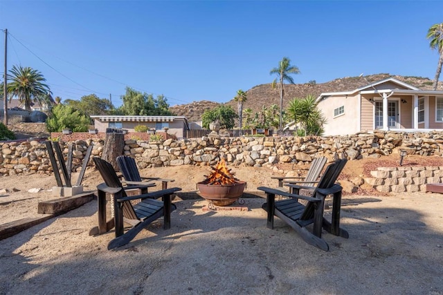 1415 Rex Ln, El Cajon, CA 92021 - view of yard featuring a fire pit and a mountain view