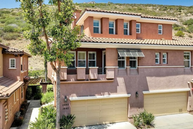 1440 Clearview Way, San Marcos, CA 92078 - view of front of property with a garage, stucco siding, a tile roof, and driveway