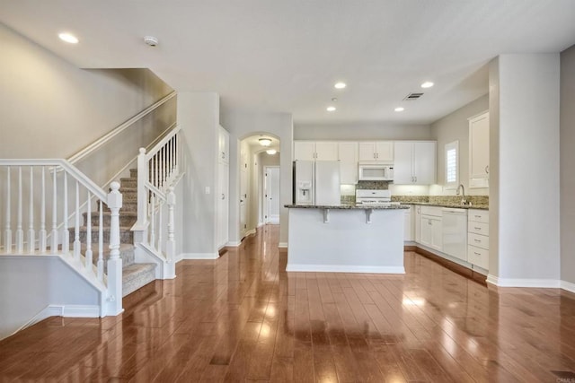 1440 Clearview Way, San Marcos, CA 92078 - kitchen featuring white appliances, a kitchen island, white cabinets, stone counters, and recessed lighting