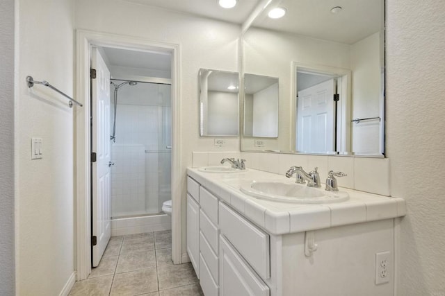1440 Clearview Way, San Marcos, CA 92078 - full bath featuring double vanity, a stall shower, tile patterned flooring, recessed lighting, and a textured wall