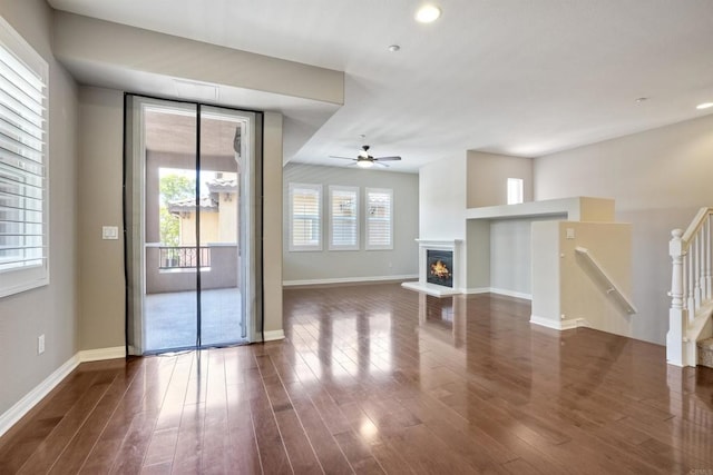 1440 Clearview Way, San Marcos, CA 92078 - unfurnished living room featuring ceiling fan, dark wood finished floors, a glass covered fireplace, and recessed lighting