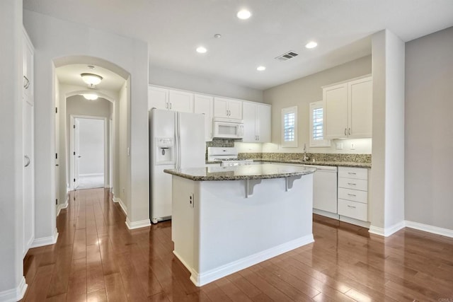 1440 Clearview Way, San Marcos, CA 92078 - kitchen featuring white appliances, a kitchen island, white cabinets, dark wood-style floors, and recessed lighting