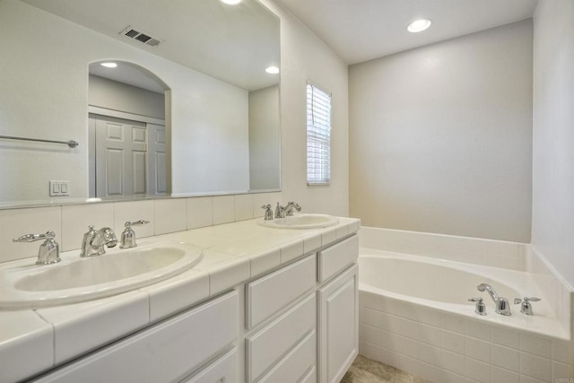 1440 Clearview Way, San Marcos, CA 92078 - full bathroom featuring double vanity, a garden tub, and recessed lighting